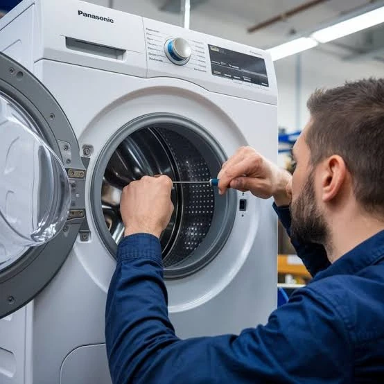 Technician checking the drum and door opening of a washing machine